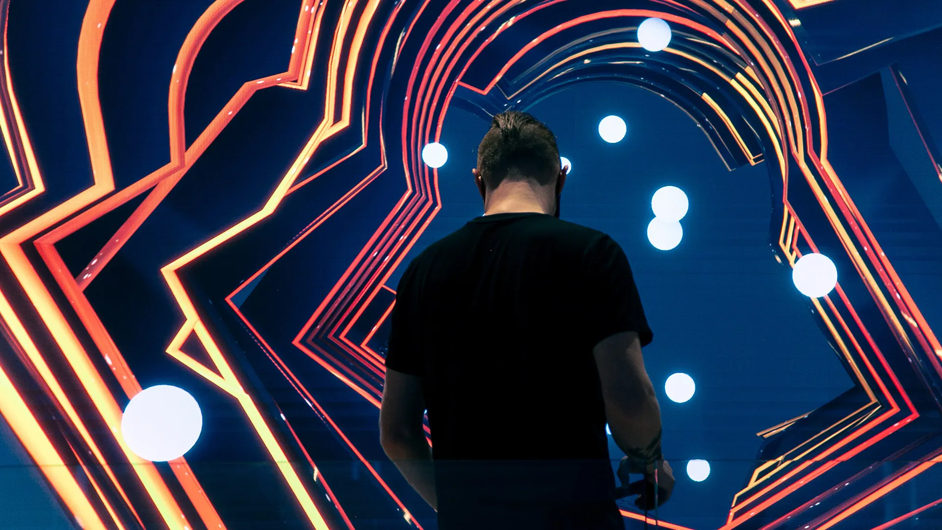 Day / Jour — visitor beneath the ring-lit digital sculpture